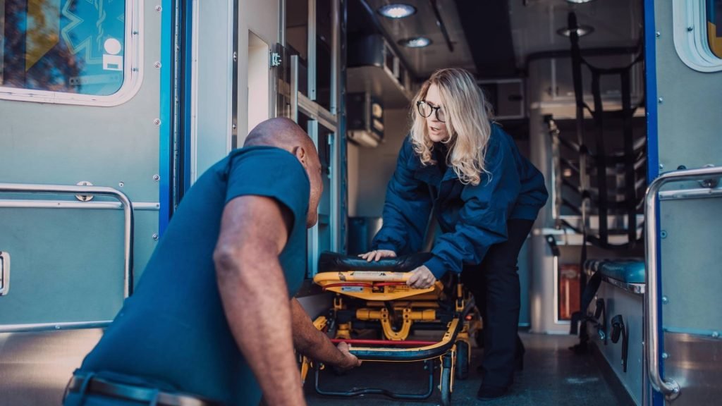 Emergency responders preparing a patient after naloxone is administered for an opioid overdose