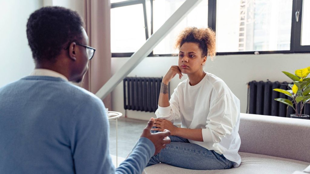 Person attending an individual therapy session for addiction with a licensed counselor.