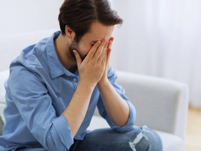 man struggling with addiction to drugs and depression