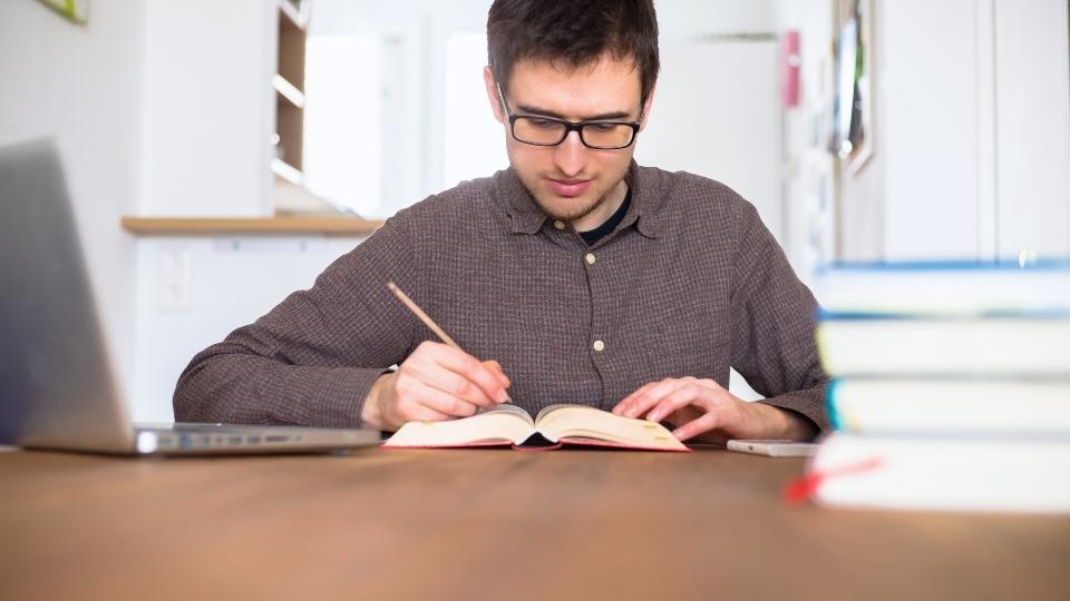 What Does United Rehab Cover For Addiction Treatment? A man researches treatment options like drug and alcohol rehab.