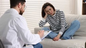 Does Insurance Cover Detox and Inpatient Rehab hero image of a woman in detox treatment.