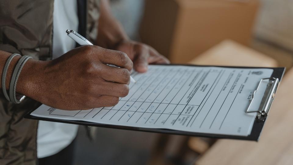 In-Network vs Out-of-Network Rehab The Costs Explained hero image of a clipboard.