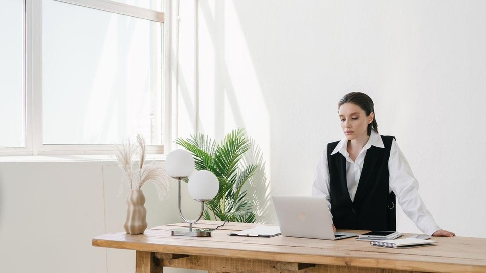 Professional using scheduled laptop time during executive rehab.